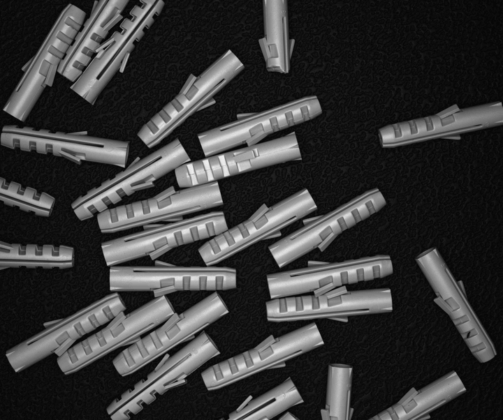 Real photos of piles of wall plugs, each pile shown under six different lighting setups in turn