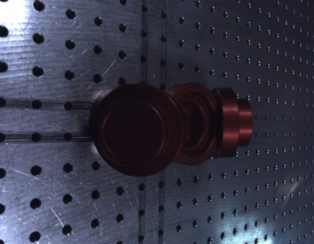 Real image: red pucks on the pegboard