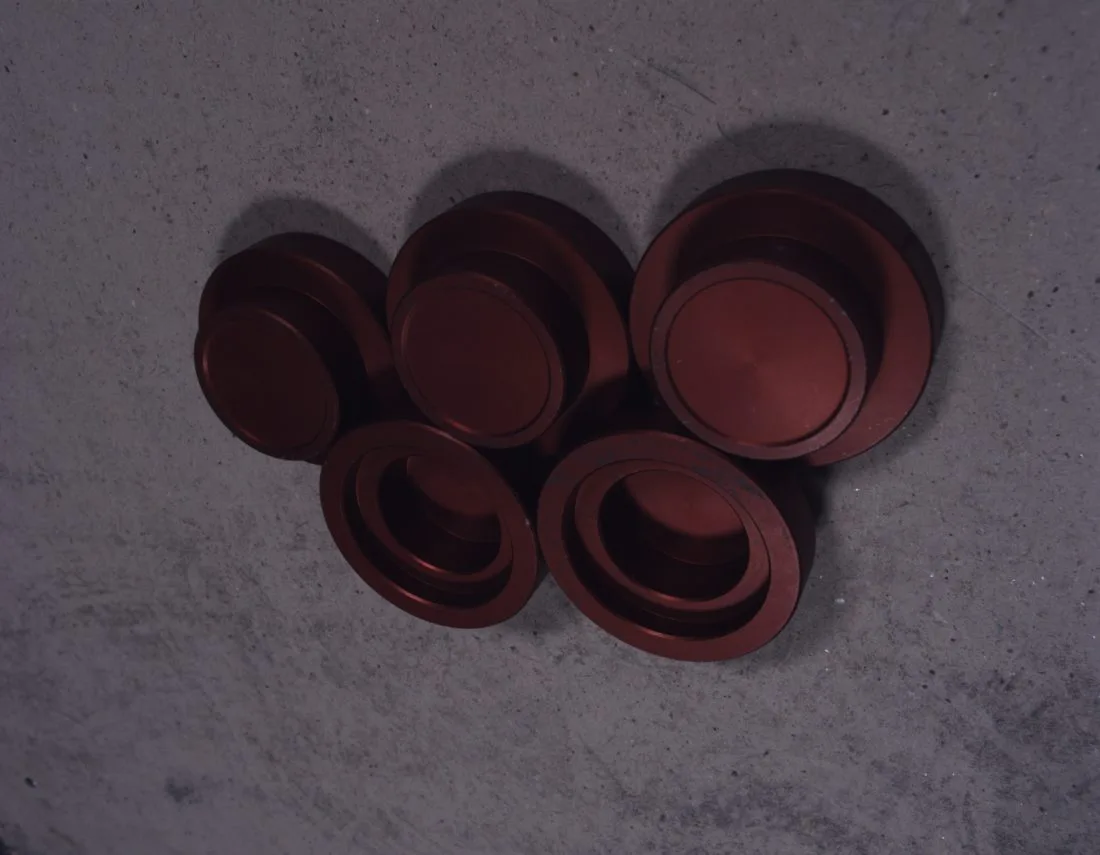 Real image: red pucks on the speckled board