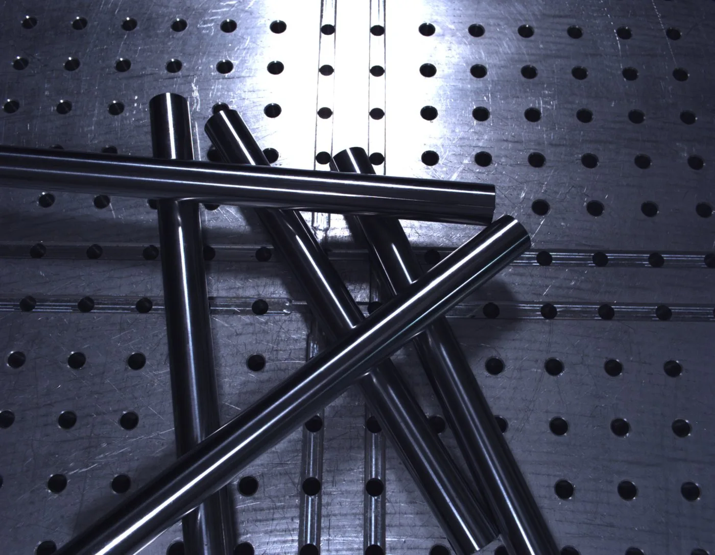 Real image: five steel rods on the pegboard