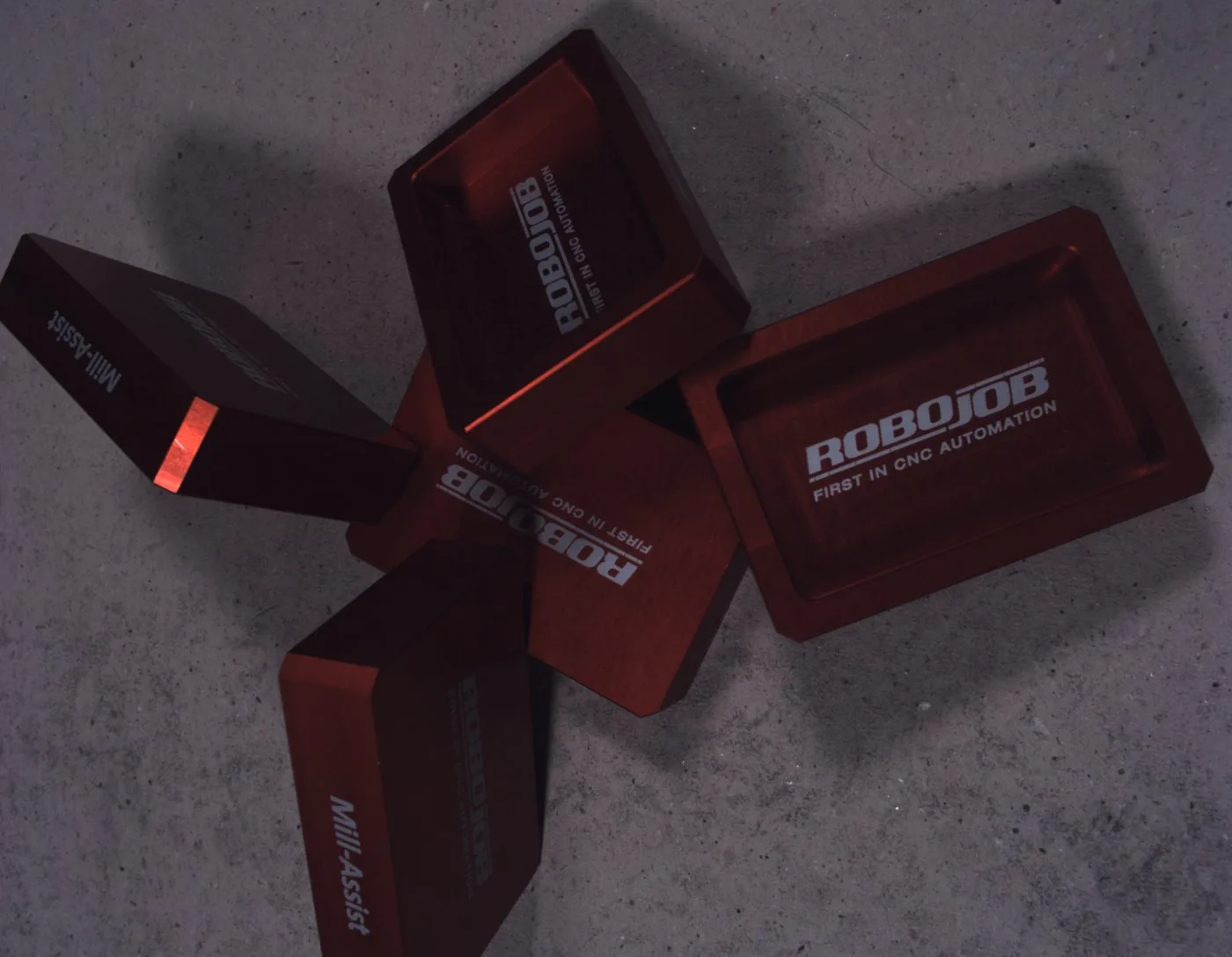 Real image: five red trays on the speckled board